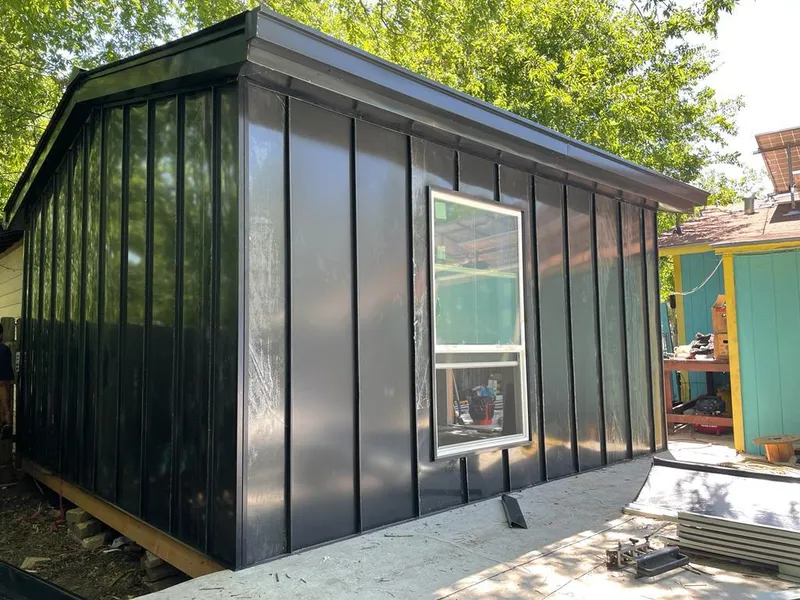 Black standing seam metal wall panels for Roof Inspection in Selma