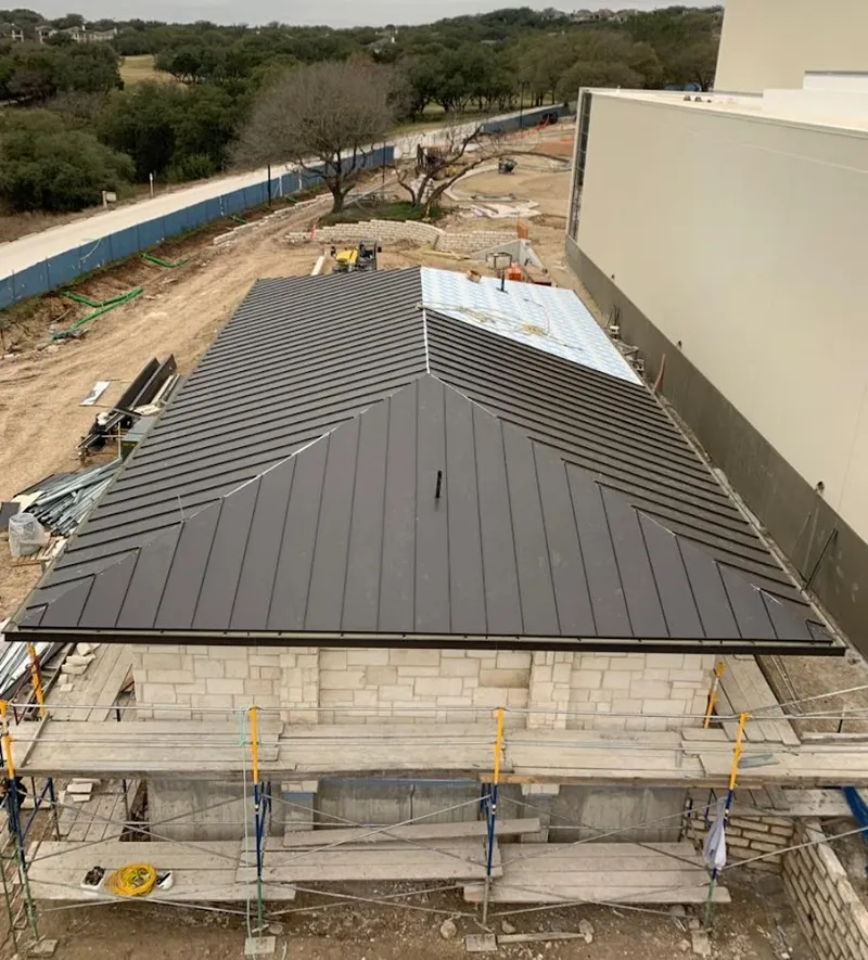 Metal roof new construction with scaffolding in Selma